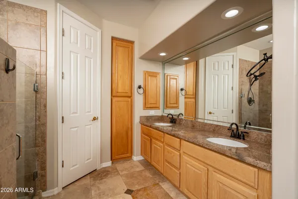 an empty room with windows and air conditioner