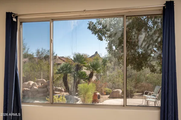 a bathroom with a sink shower and a mirror