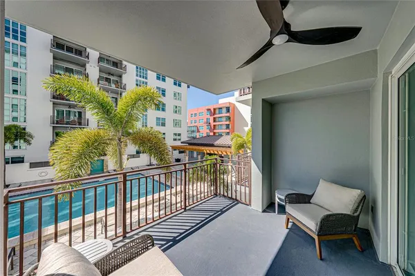 swimming pool view with a outdoor seating
