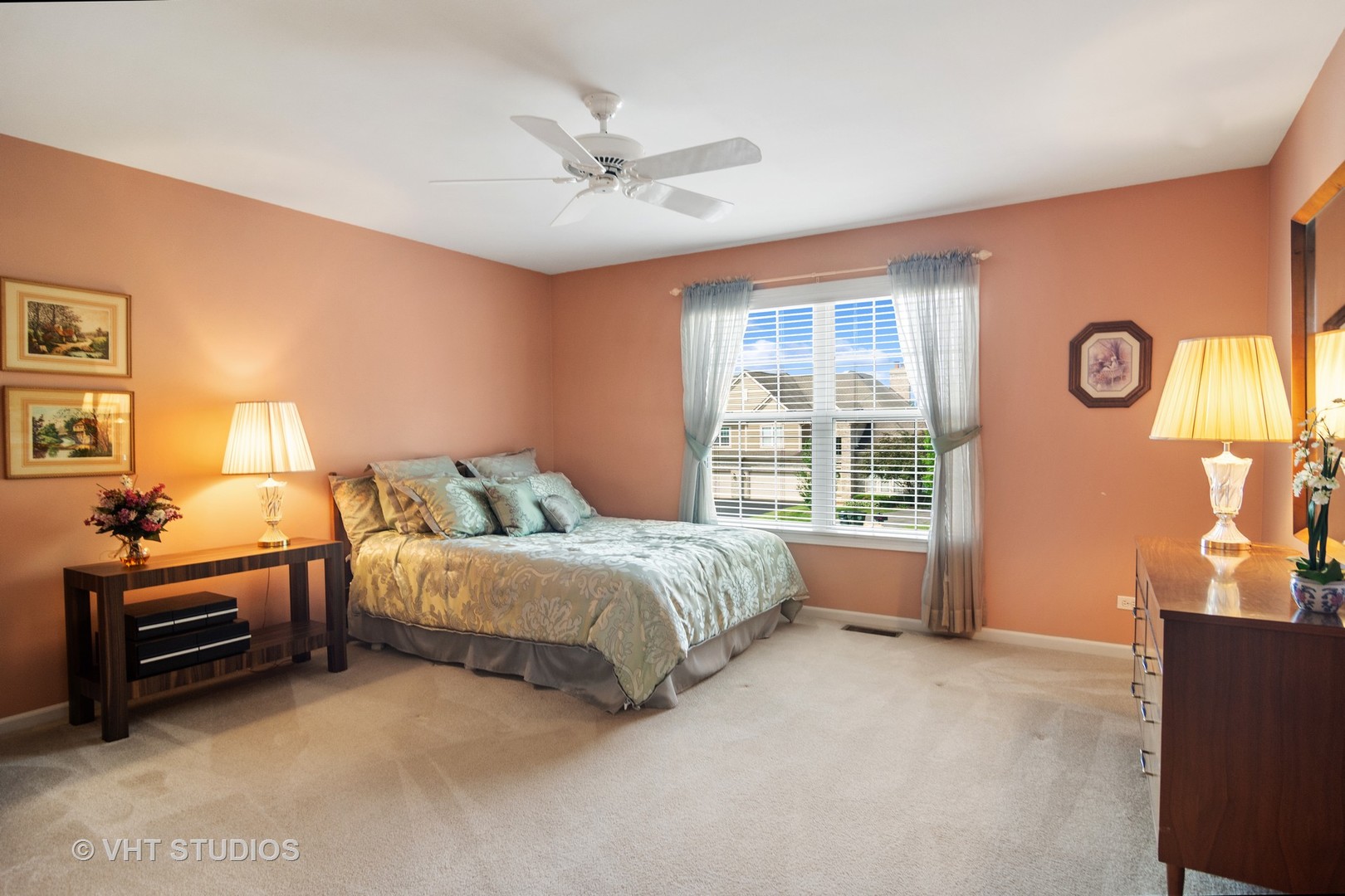 716 Fieldstone Court Inverness, IL 60010 - Photo 19 of 25 a spacious bedroom with a bed and a chandelier