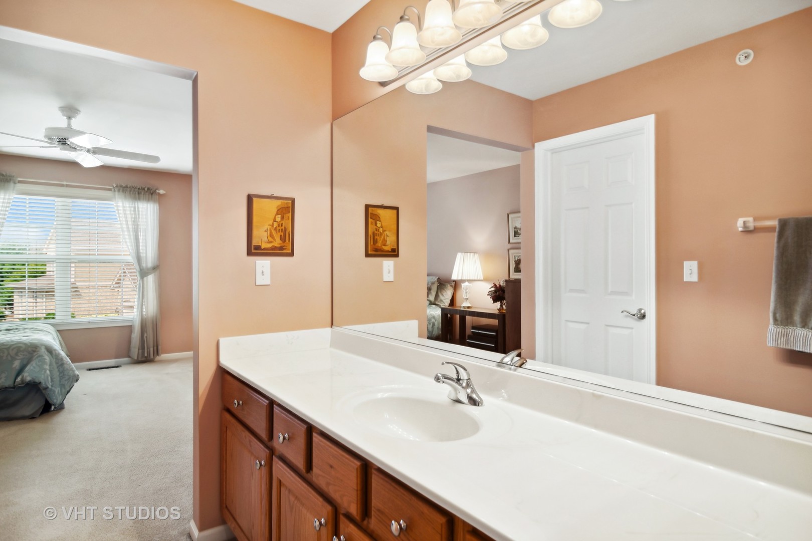 716 Fieldstone Court Inverness, IL 60010 - Photo 20 of 25 a en suite bathroom with a double vanity sink and a mirror