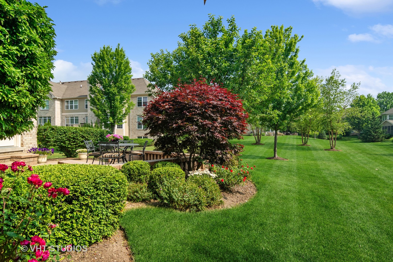 716 Fieldstone Court Inverness, IL 60010 - Photo 24 of 25 a view of a garden with large trees