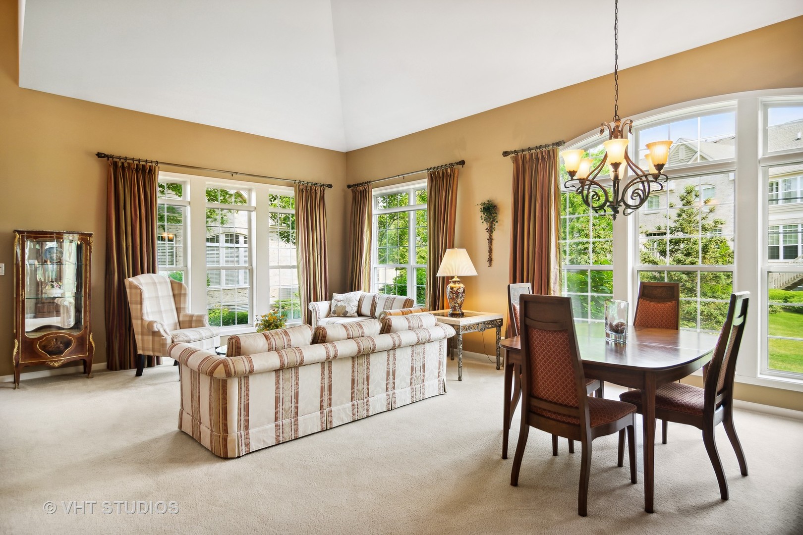 716 Fieldstone Court Inverness, IL 60010 - Photo 6 of 25 a living room with furniture a flat screen tv and a large window