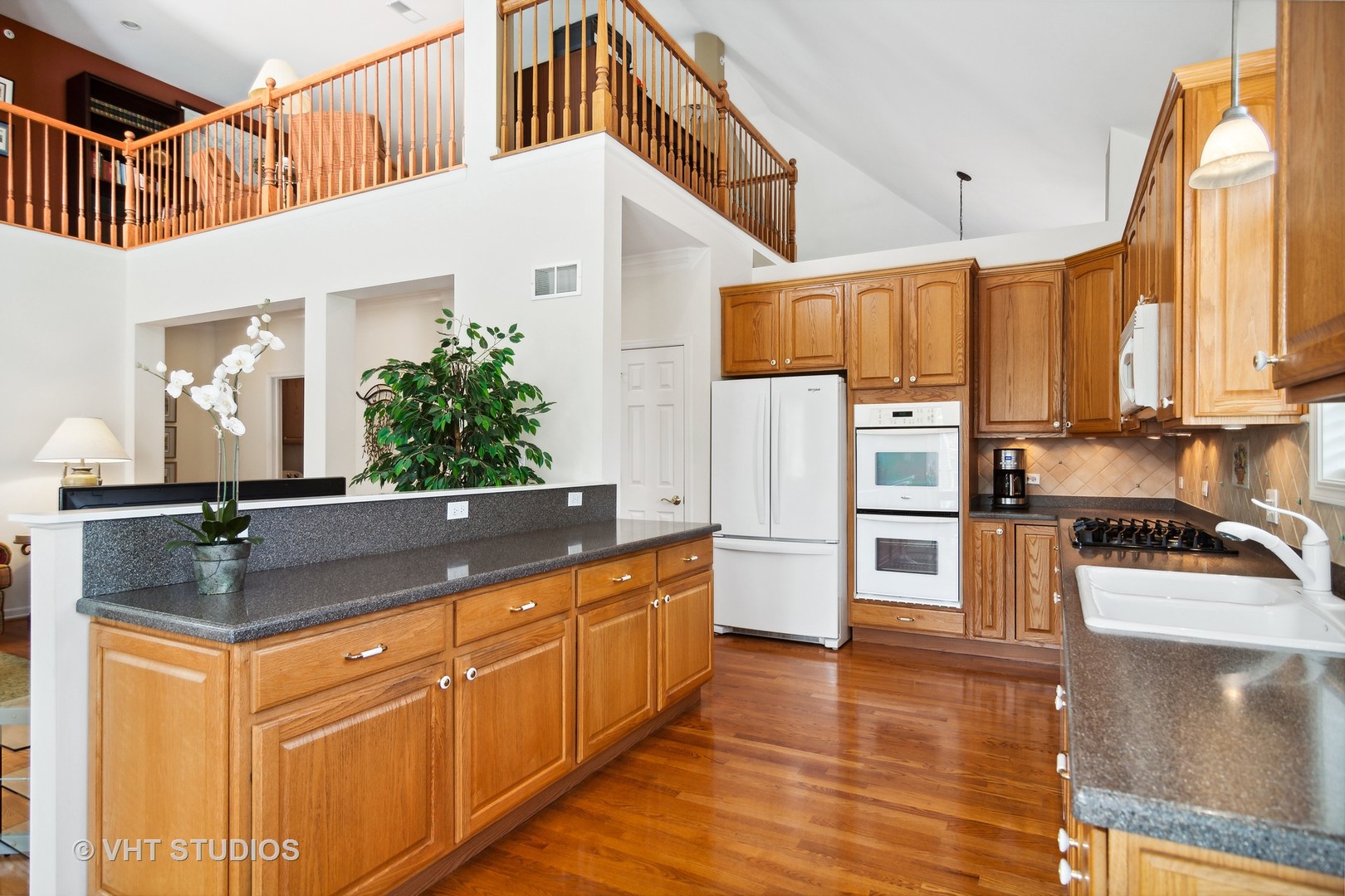 716 Fieldstone Court Inverness, IL 60010 - Photo 7 of 25 a kitchen with stainless steel appliances granite countertop a sink a stove and a refrigerator