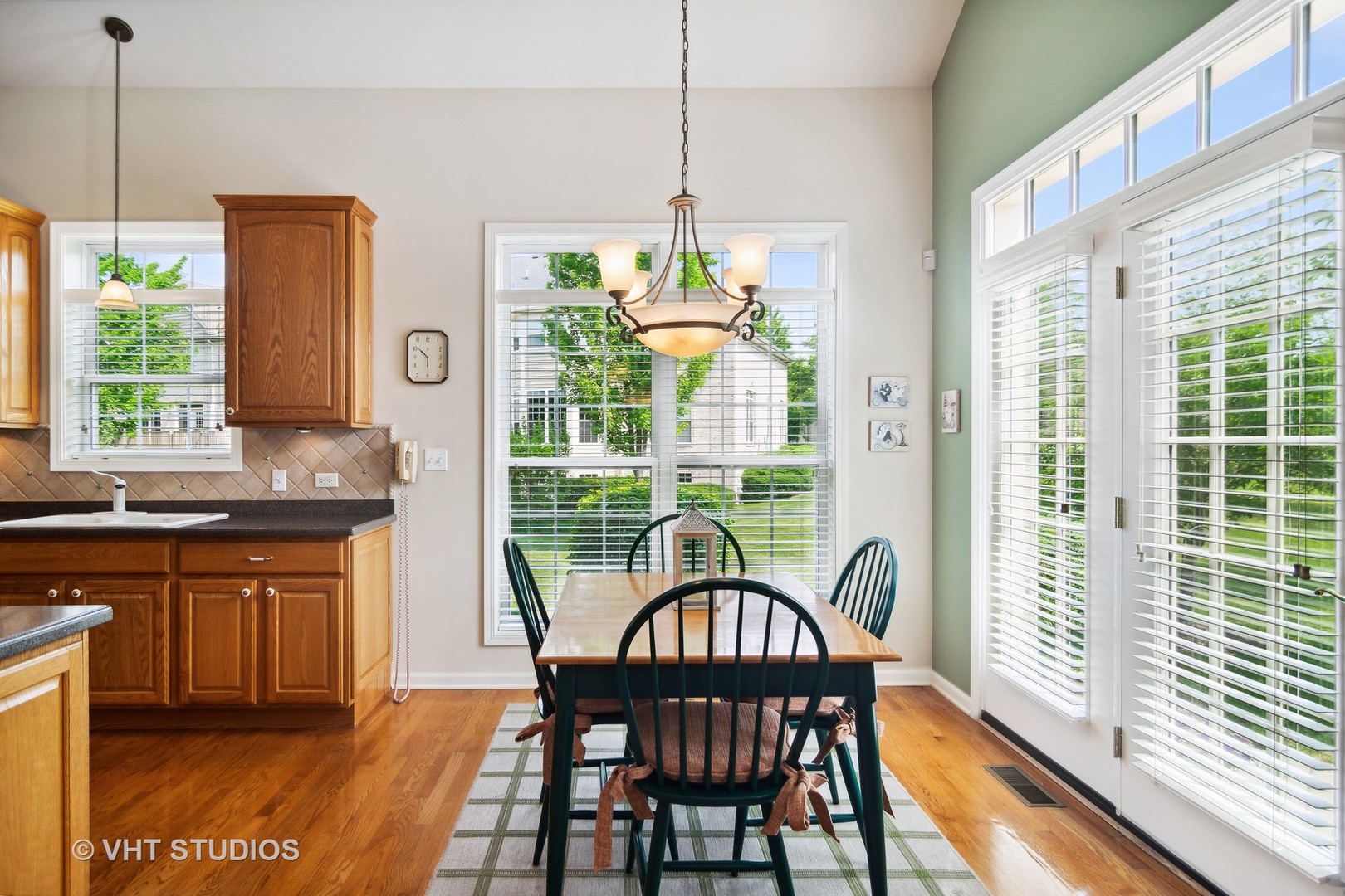 716 Fieldstone Court Inverness, IL 60010 - Photo 8 of 25 a dining room with furniture a chandelier and wooden floor