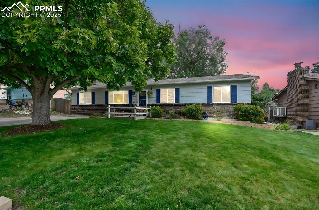 5139 Villa Circle Colorado Springs, CO 80918 - Photo 1 of 40 a front view of house with yard and green space