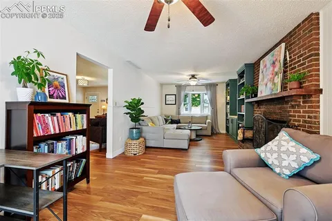 a living room with furniture and a bookshelf
