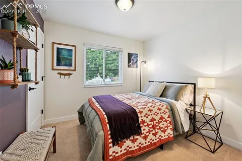 a bedroom with a bed and window