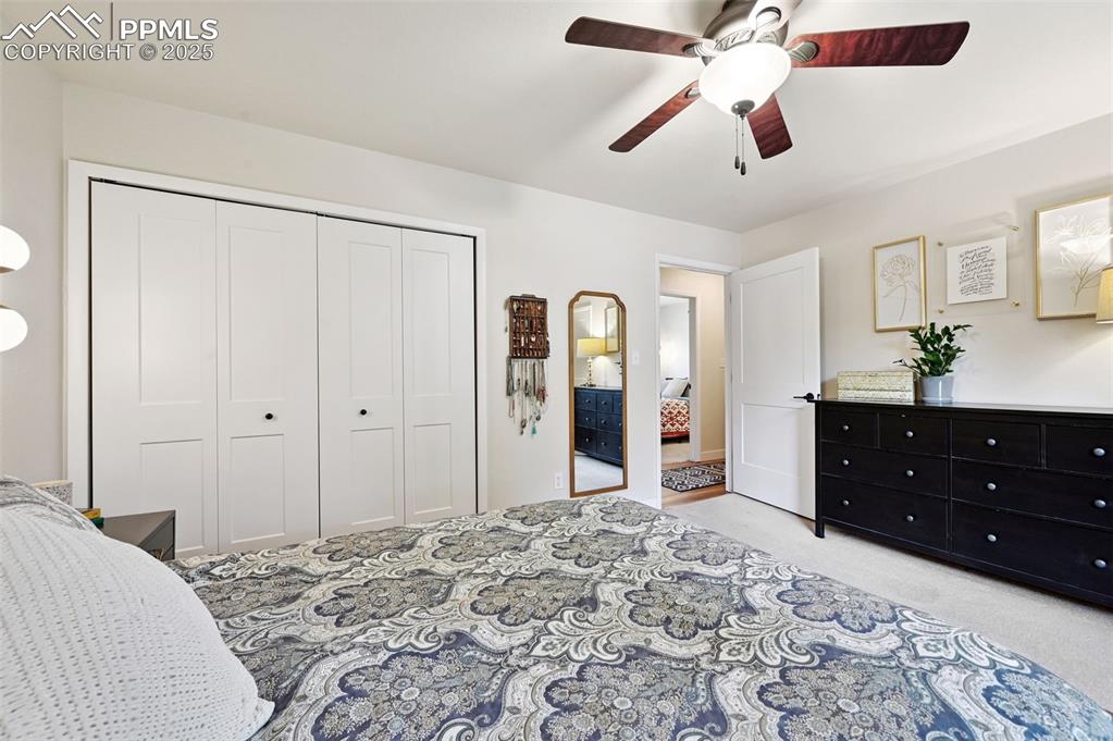 5139 Villa Circle Colorado Springs, CO 80918 - Photo 23 of 40 a bedroom with a bed and a mirror on dresser