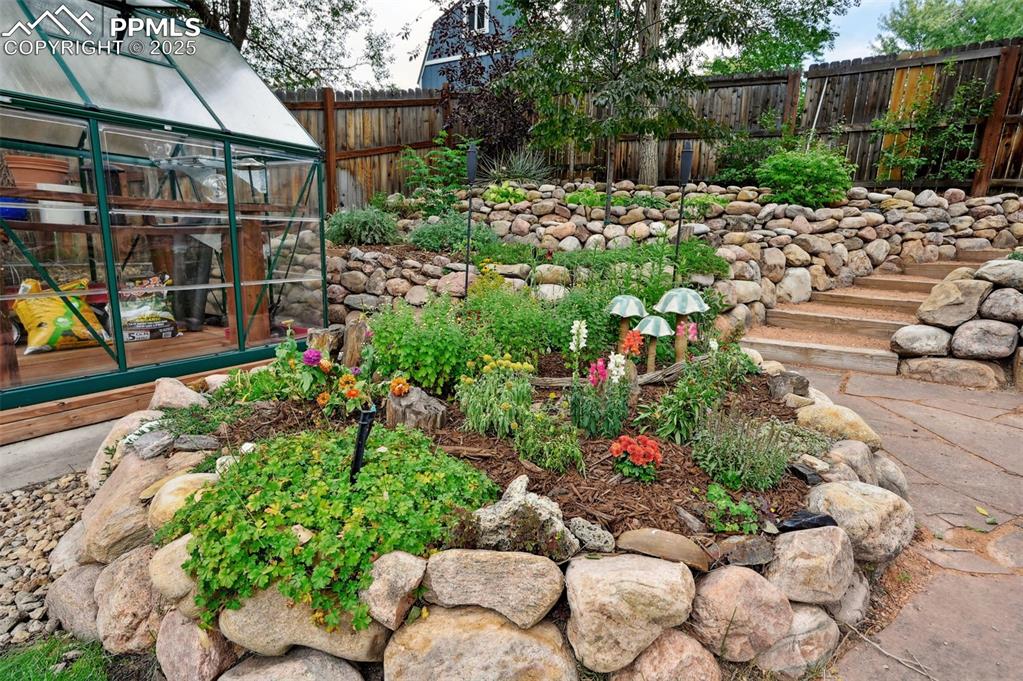 5139 Villa Circle Colorado Springs, CO 80918 - Photo 27 of 40 a view of a garden with flowers and flowers