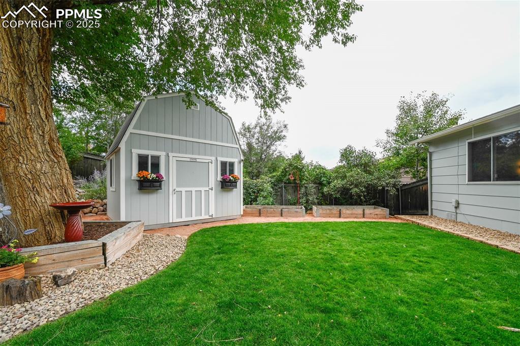 5139 Villa Circle Colorado Springs, CO 80918 - Photo 28 of 40 a front view of a house with a yard and trees