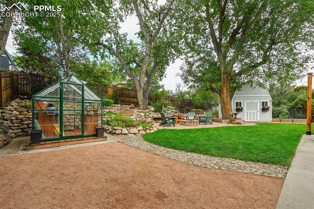 5139 Villa Circle Colorado Springs, CO 80918 - Photo 31 of 40 a view of a garden with wooden fence