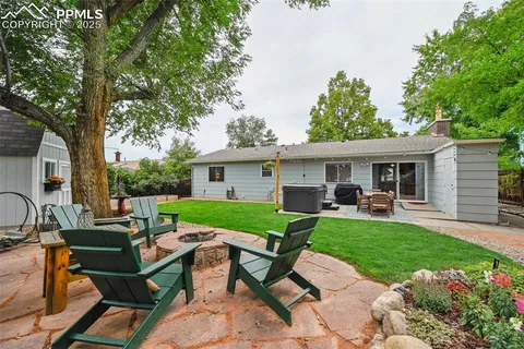 an aerial view of a house with an outdoor space