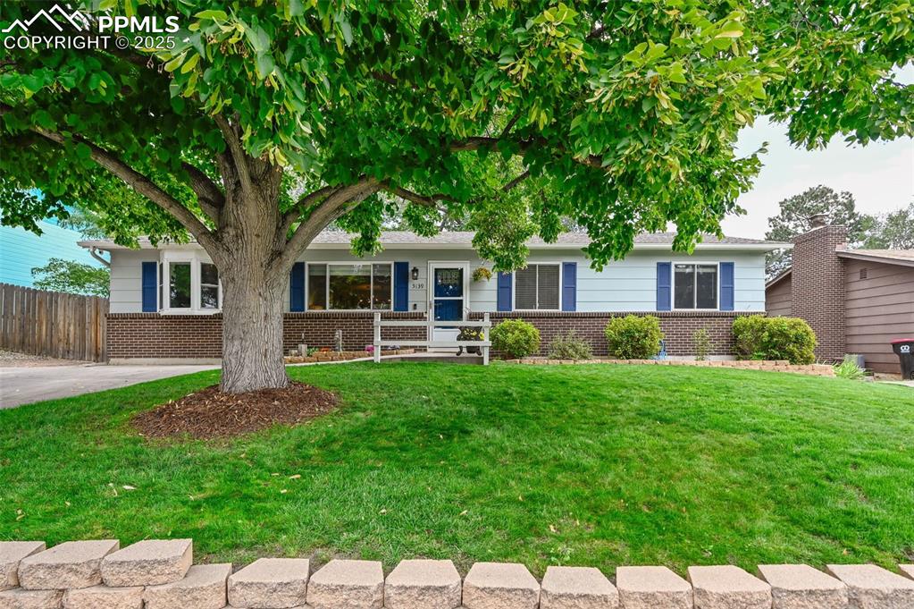 5139 Villa Circle Colorado Springs, CO 80918 - Photo 37 of 40 a front view of a house with a yard