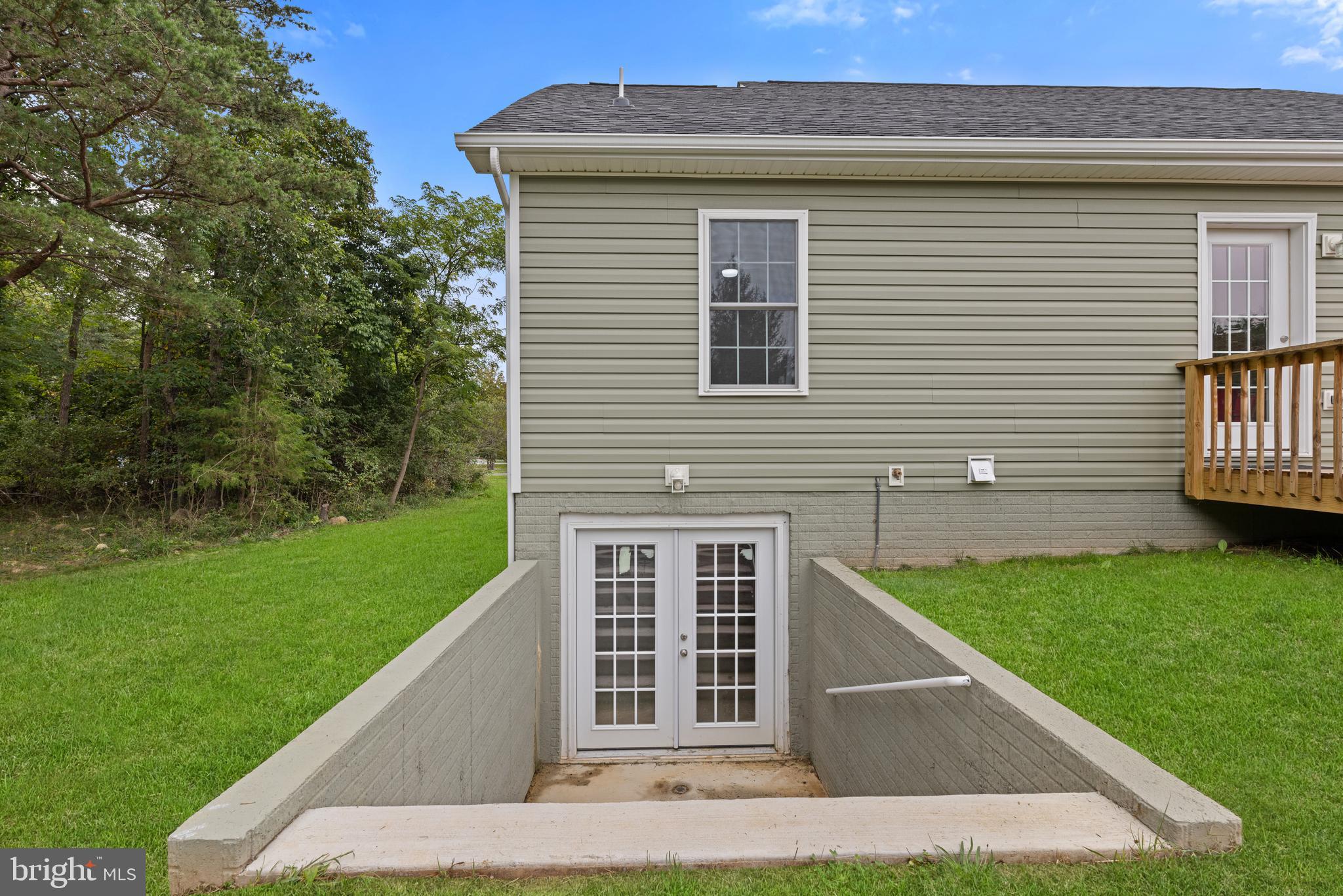 61 MDG Court Berkeley Springs, WV 25411 - Photo 14 of 47 a front view of a house with a yard
