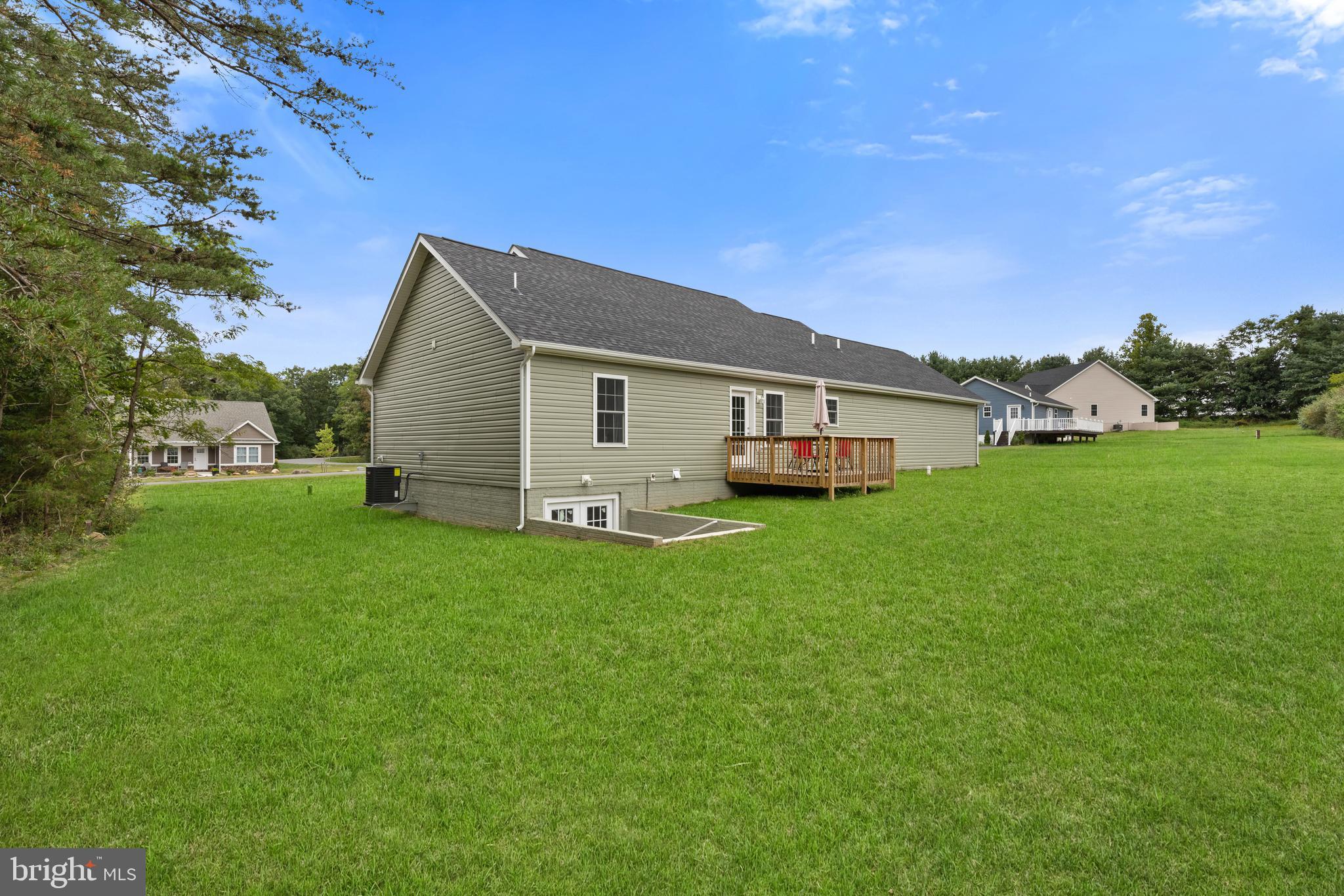 61 MDG Court Berkeley Springs, WV 25411 - Photo 15 of 47 a front view of house with yard and green space