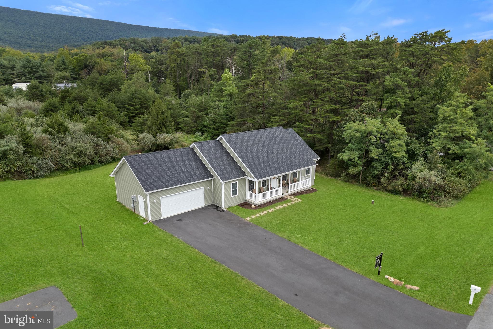 61 MDG Court Berkeley Springs, WV 25411 - Photo 2 of 47 a aerial view of a house with a yard