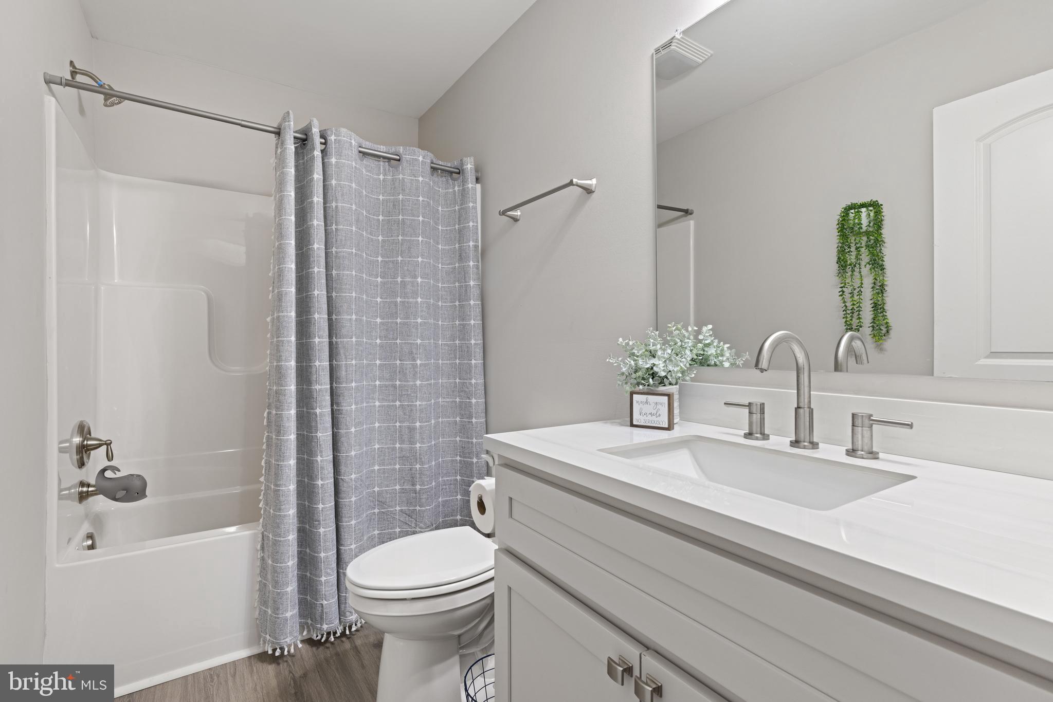 61 MDG Court Berkeley Springs, WV 25411 - Photo 24 of 47 a bathroom with a sink toilet and shower