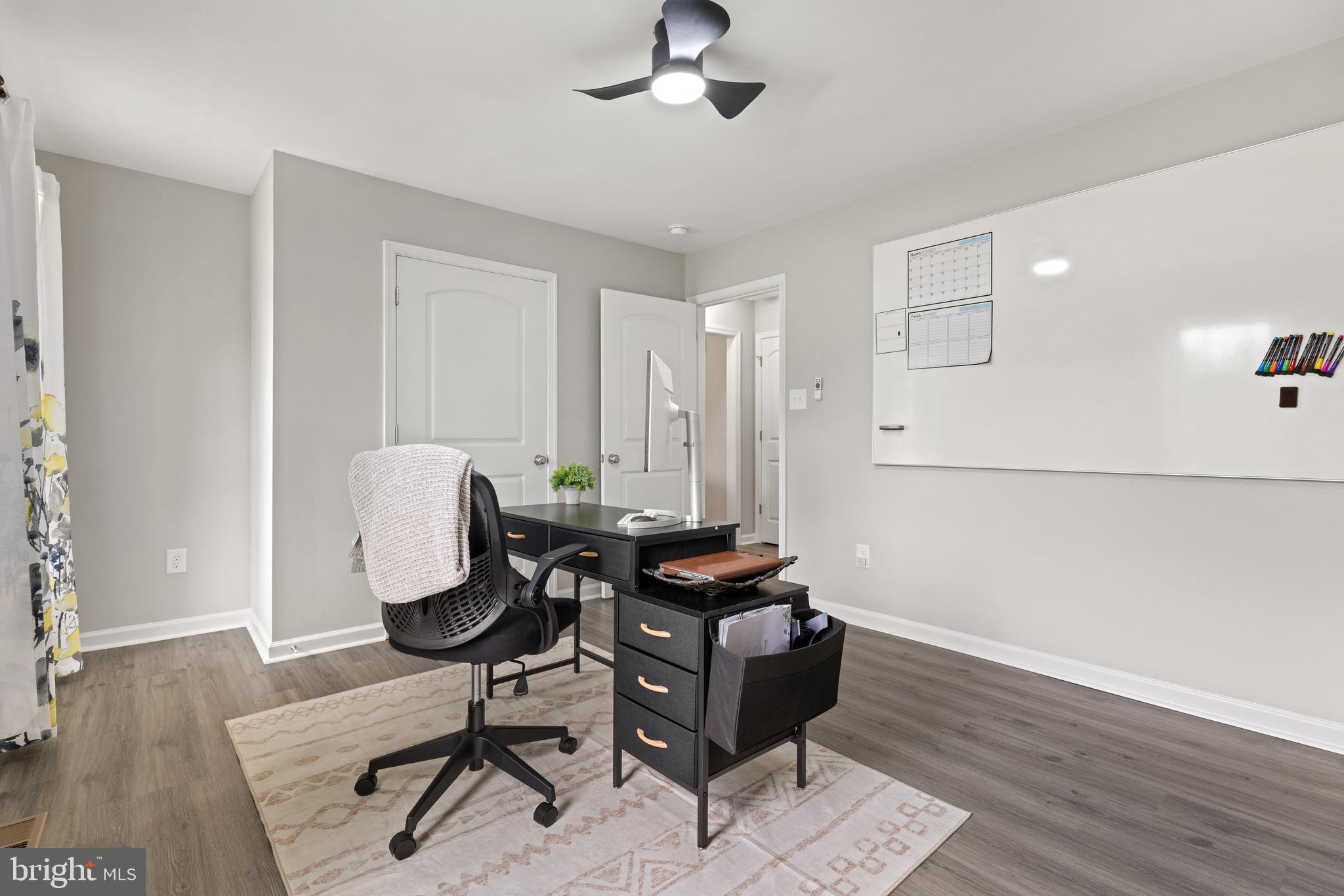 61 MDG Court Berkeley Springs, WV 25411 - Photo 26 of 47 a view of a workspace with furniture and wooden floor