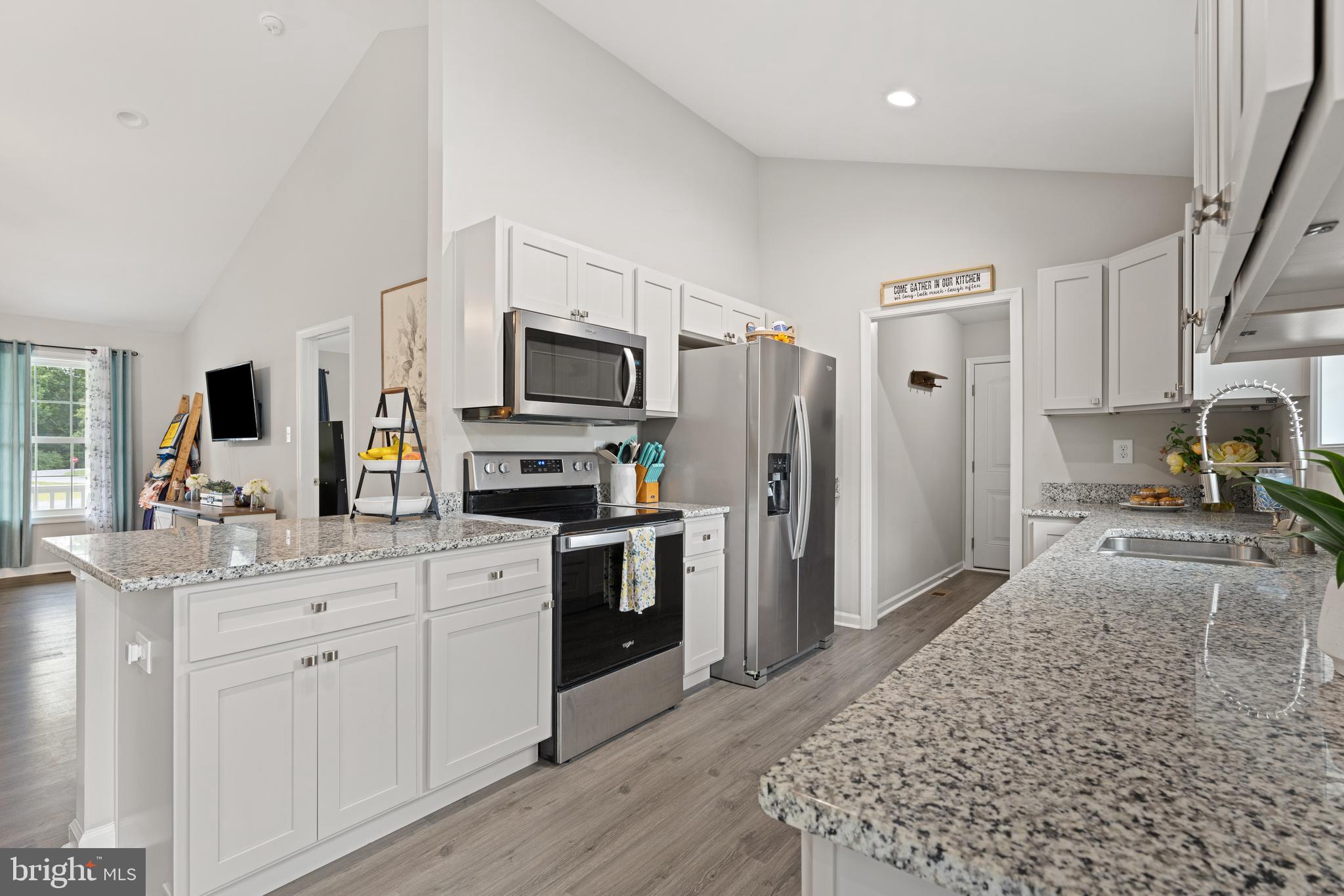 61 MDG Court Berkeley Springs, WV 25411 - Photo 34 of 47 a kitchen with a sink stove and refrigerator
