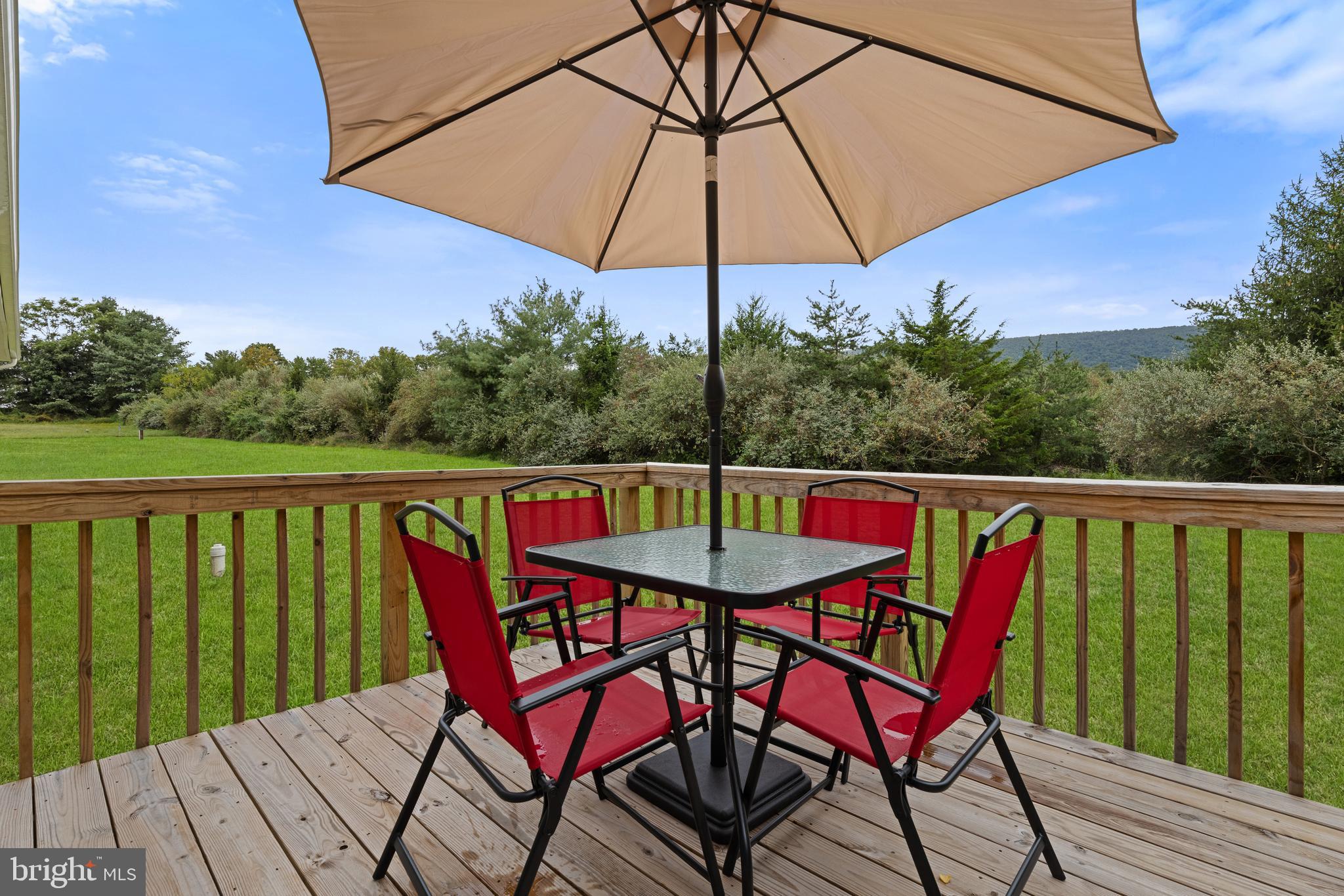 61 MDG Court Berkeley Springs, WV 25411 - Photo 39 of 47 a view of balcony with furniture and wooden floor