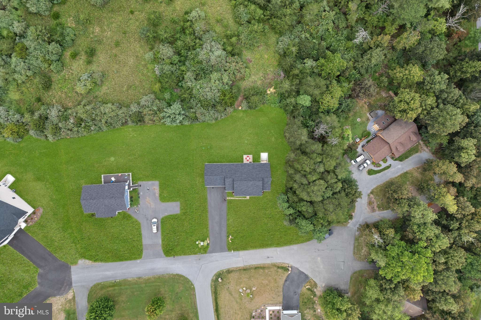 61 MDG Court Berkeley Springs, WV 25411 - Photo 43 of 47 an aerial view of a house with a yard basket ball court and outdoor seating
