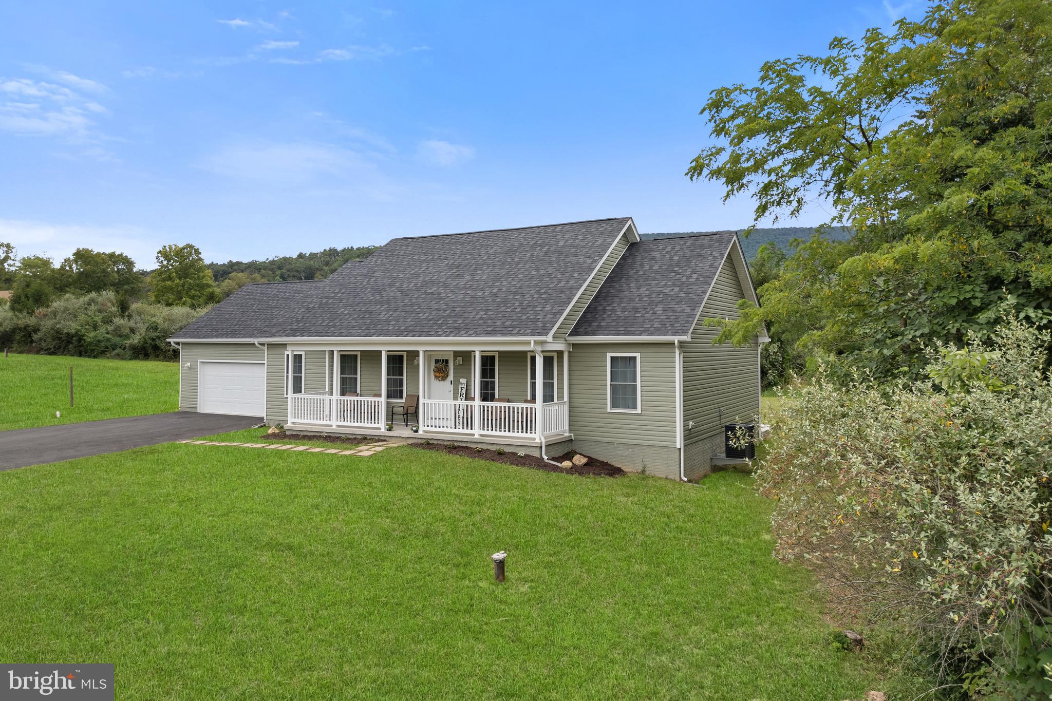 61 MDG Court Berkeley Springs, WV 25411 - Photo 46 of 47 front view of a house with a yard