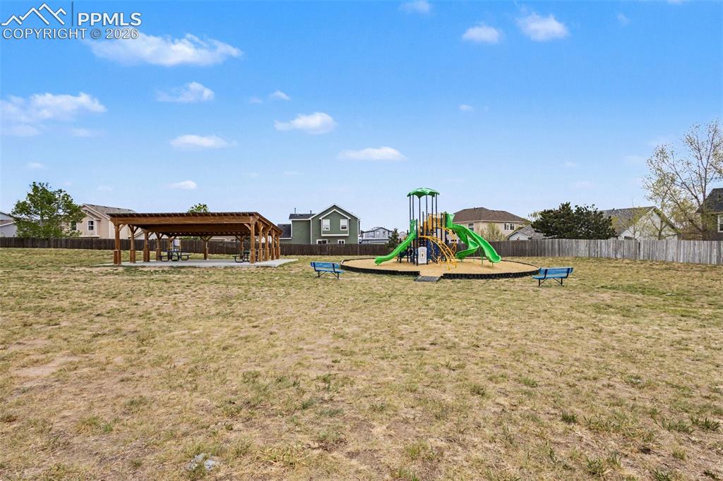 12210 Crystal Downs Road Peyton, CO 80831 - Photo 35 of 40 a backyard of a house with lots of green space
