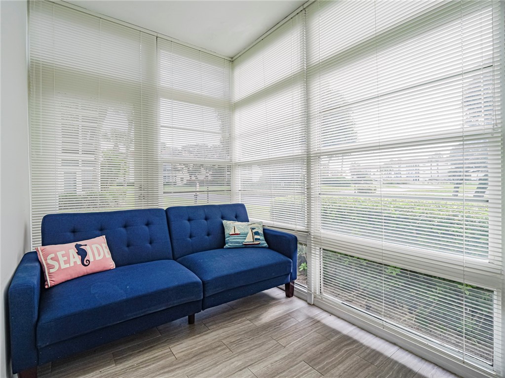 5400 Highway A1a, Unit D3 Vero Beach, FL 32963 - Photo 20 of 35 a living room with furniture and a floor to ceiling window