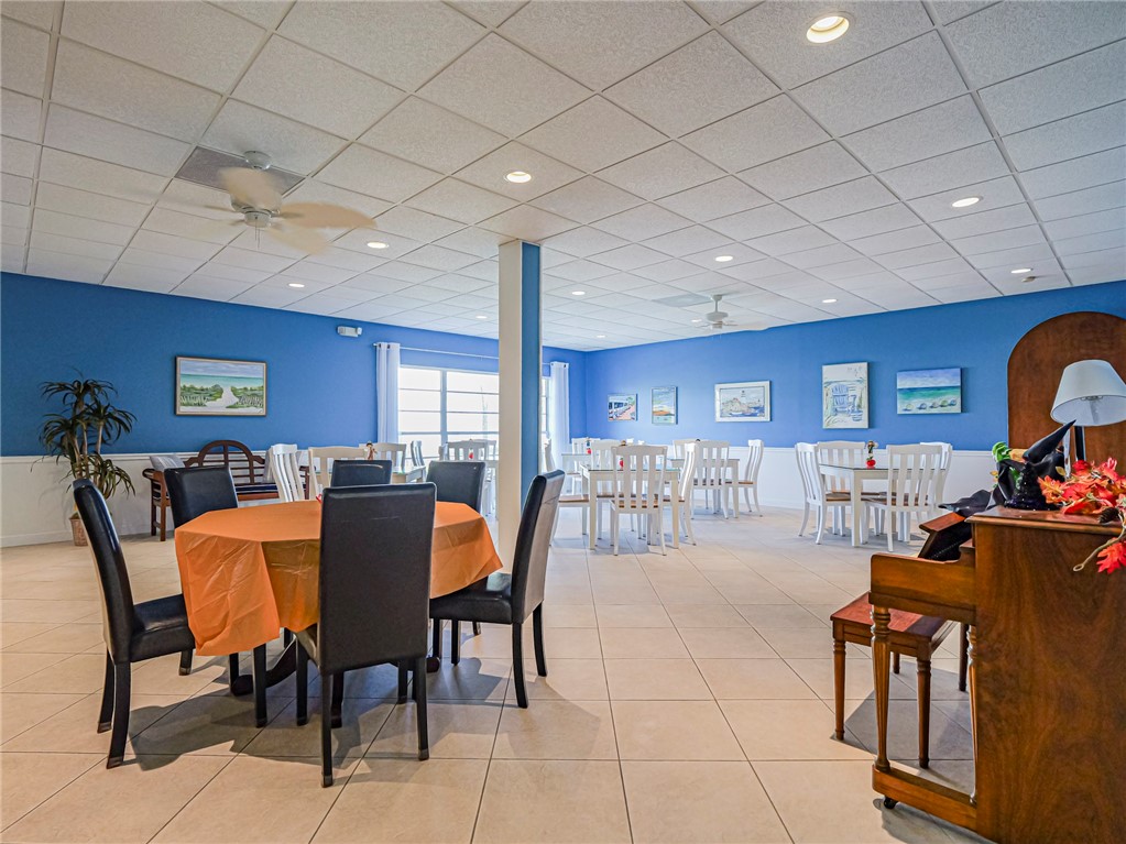 5400 Highway A1a, Unit D3 Vero Beach, FL 32963 - Photo 30 of 35 a dining room with furniture and a floor to ceiling window