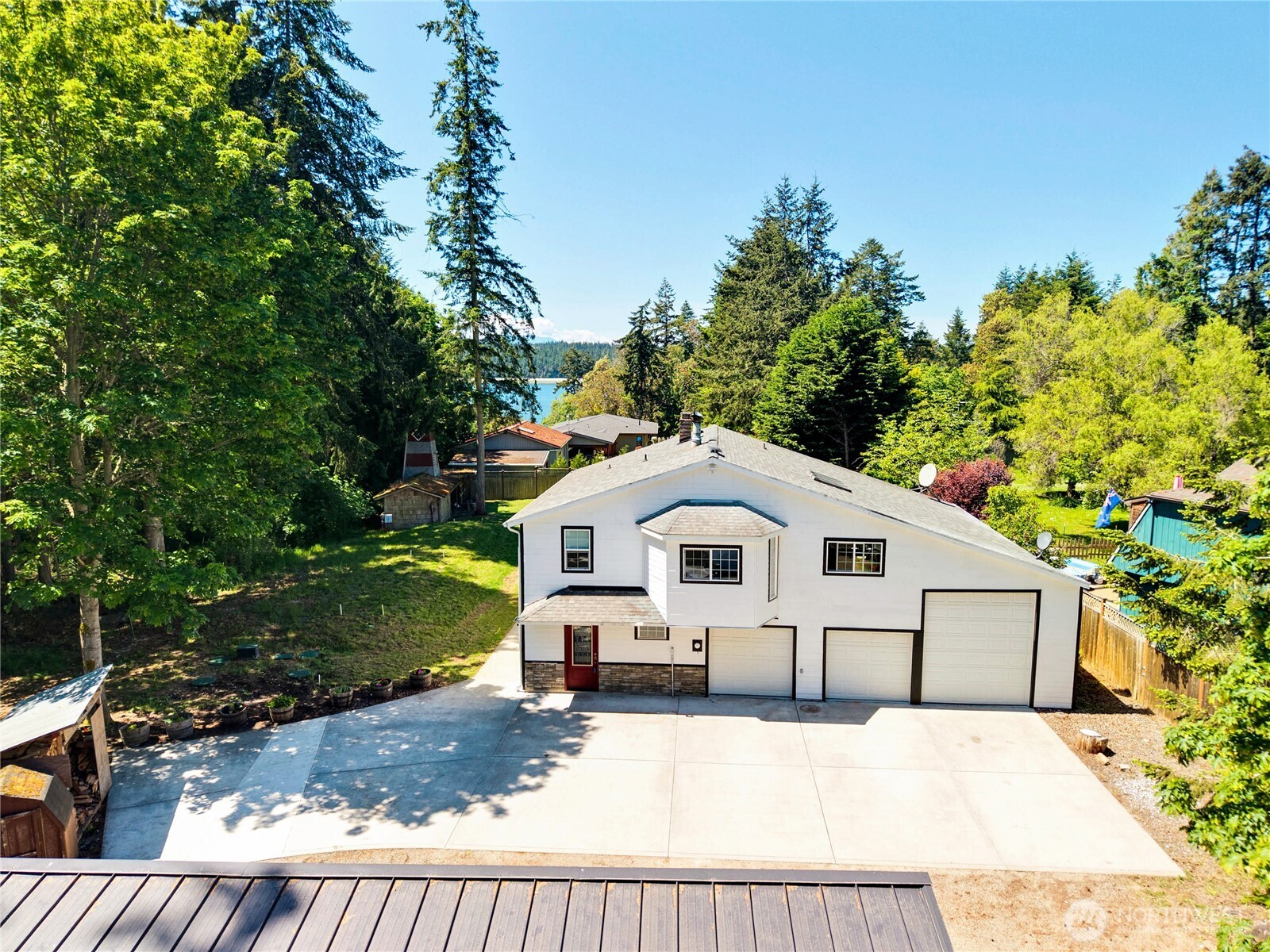 196 Nolton Road Nordland, WA 98358 - Photo 1 of 39 a front view of a house with a yard