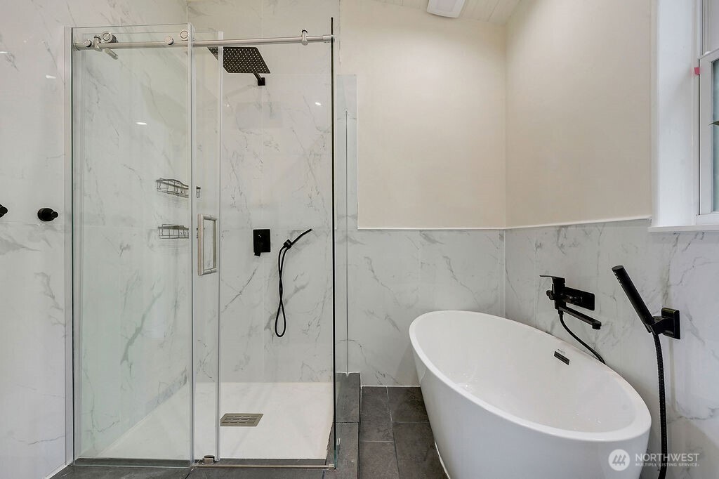 196 Nolton Road Nordland, WA 98358 - Photo 26 of 39 a bathroom with a bathtub and a shower