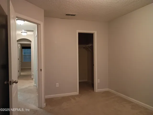 an empty room and closet area