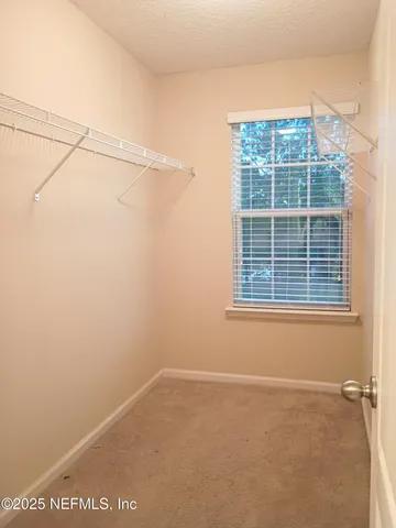 a view of a room that has a window in it