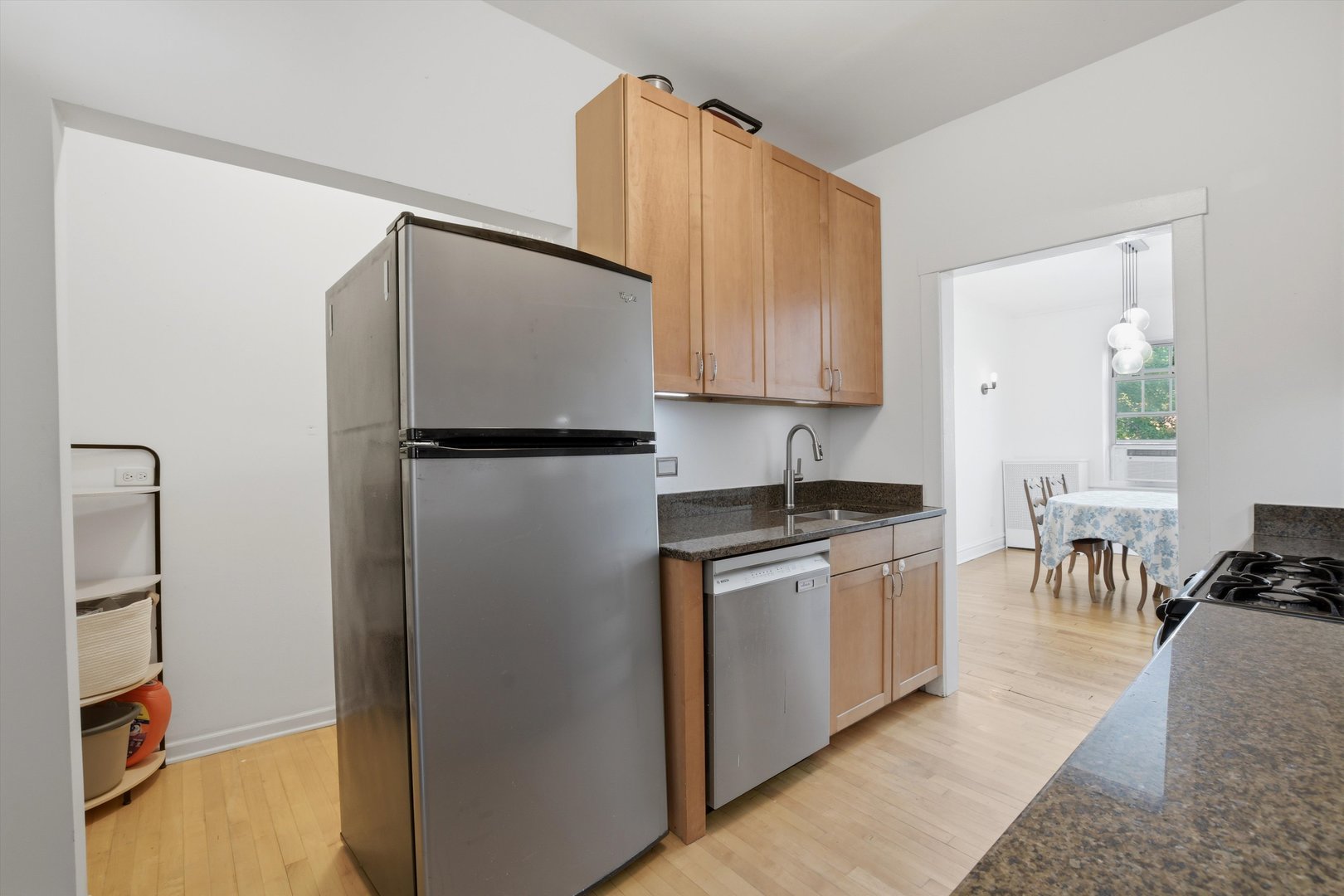 240 South Maple Avenue, Unit 1W Oak Park, IL 60302 - Photo 6 of 11 a kitchen with stainless steel appliances granite countertop a refrigerator and a stove