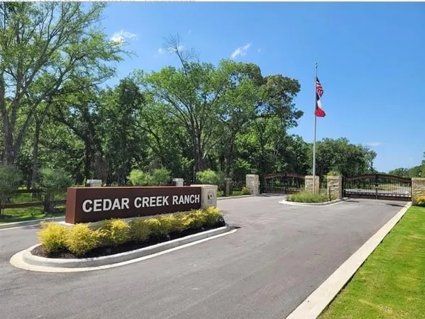 a view of a park that has a sign board