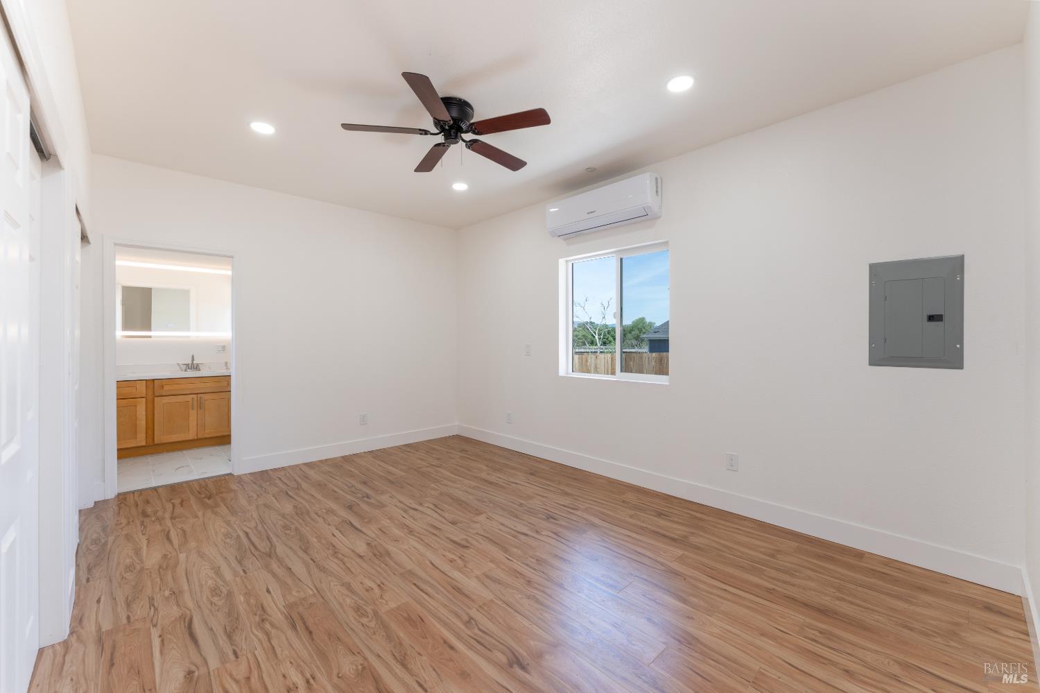 6100 Eastside Calpella Road Ukiah, CA 95482 - Photo 11 of 16 a view of a big room with wooden floor closet and windows