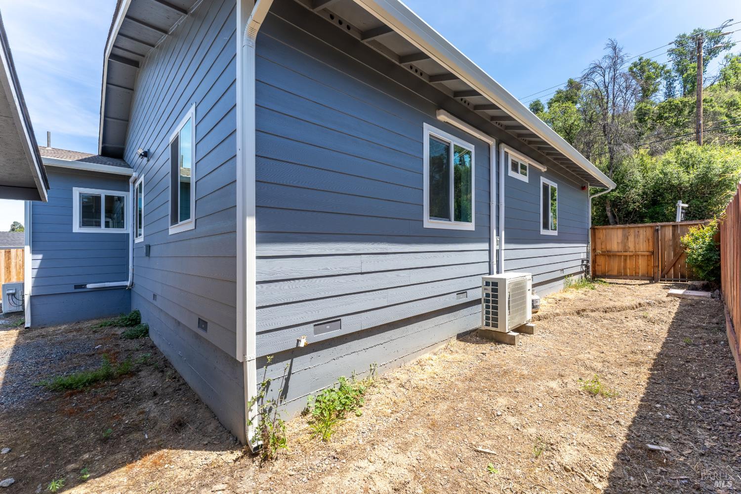 6100 Eastside Calpella Road Ukiah, CA 95482 - Photo 15 of 16 a side view of a house with a yard
