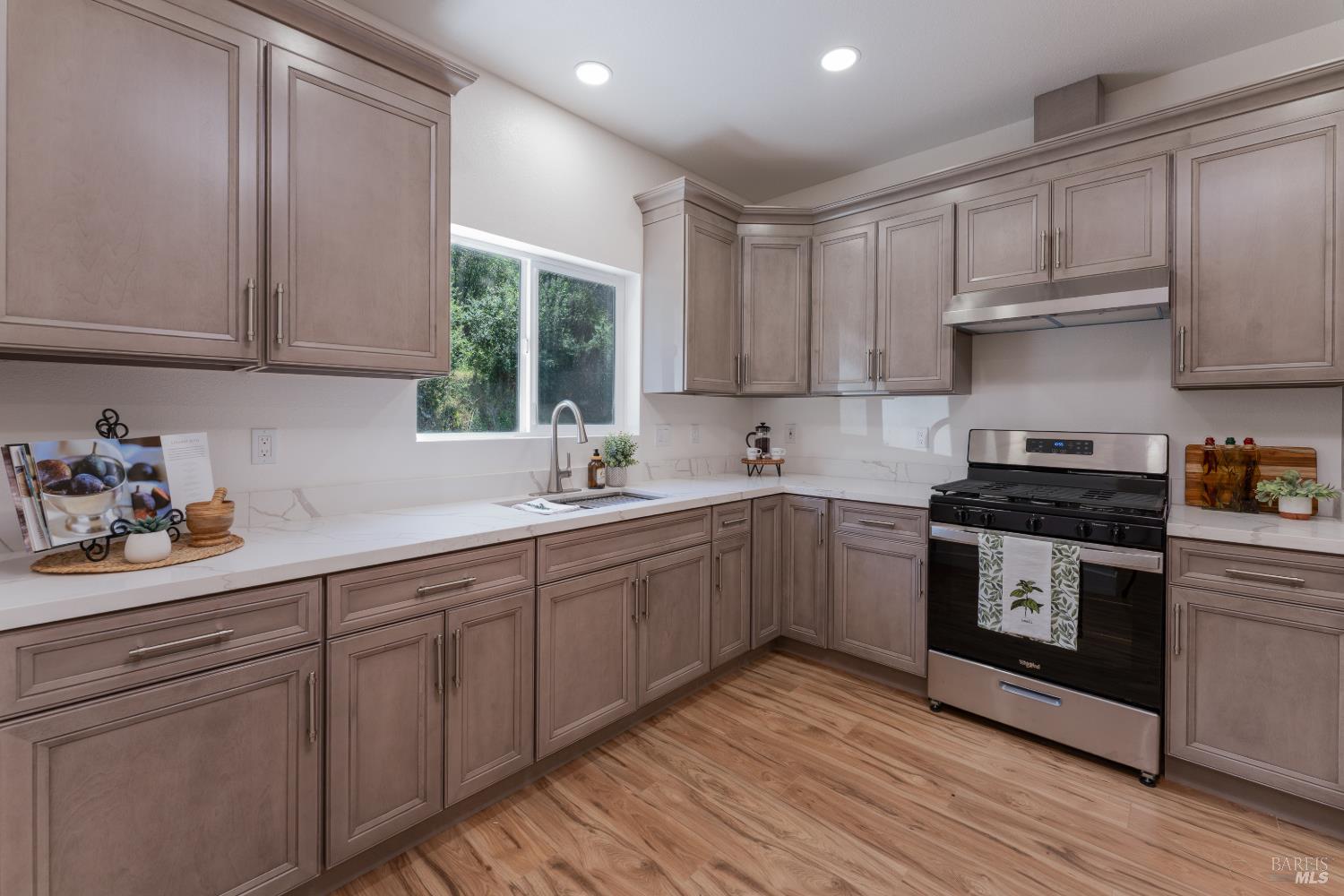 6100 Eastside Calpella Road Ukiah, CA 95482 - Photo 2 of 16 a kitchen with a sink cabinets and wooden floor