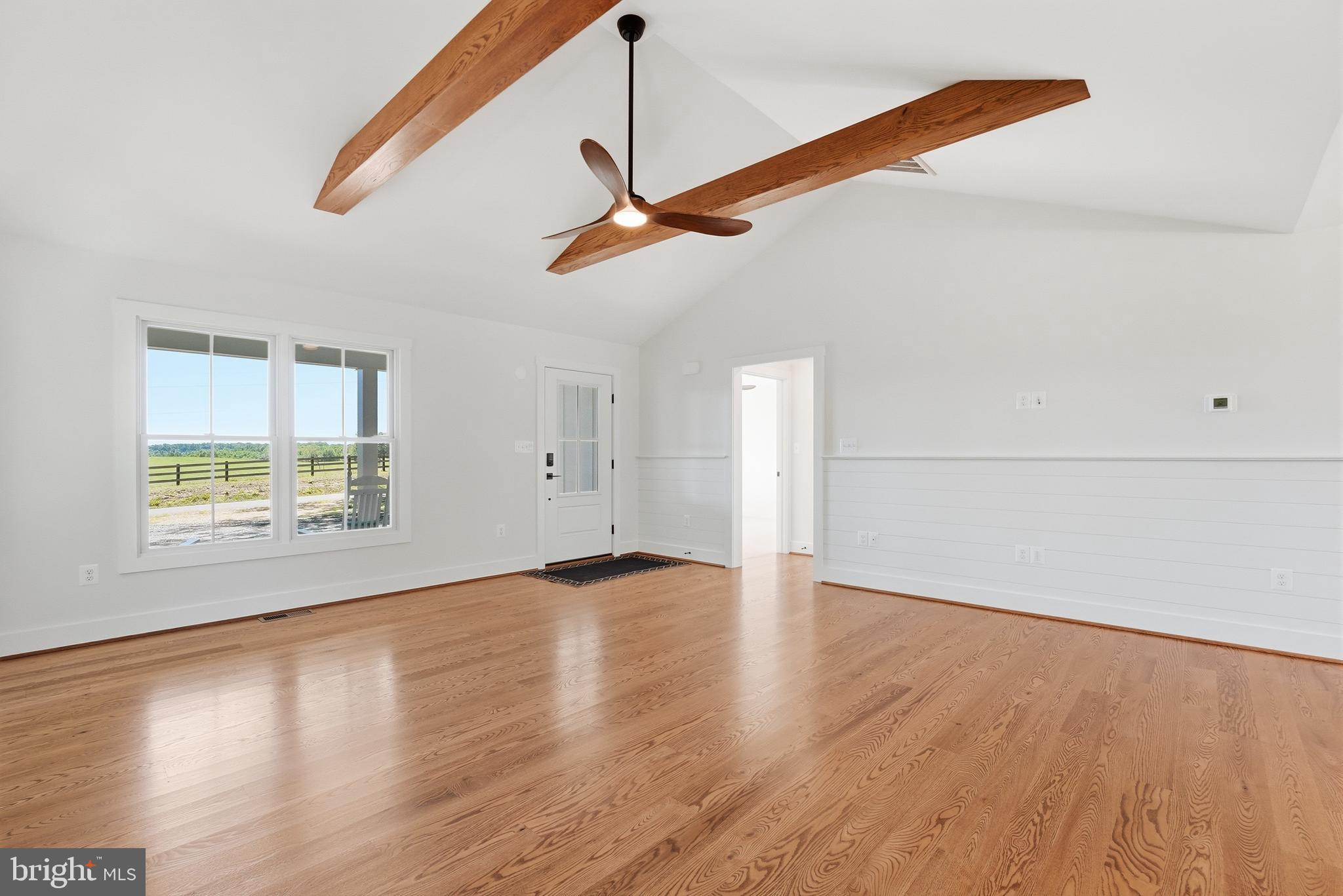 1548 James City Road Reva, VA 22735 - Photo 9 of 48 a view of an empty room with wooden floor and a ceiling fan