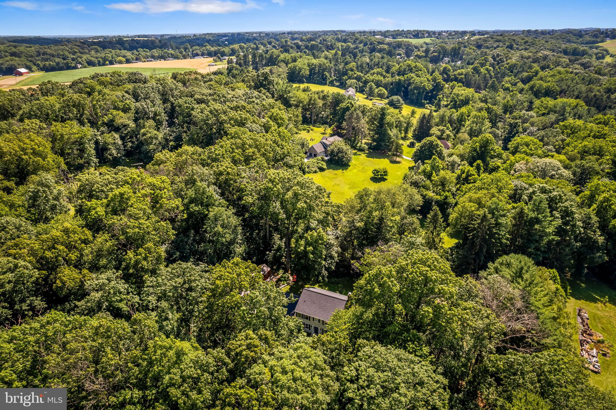 5026 Mt Carmel Road Hampstead, MD 21074 - Photo 50 of 57 a view of a city with lush green forest