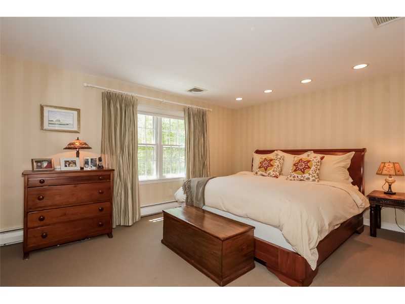 383 Middlesex Road Darien, CT 06820 - Photo 14 of 23 a bedroom with a bed and a window
