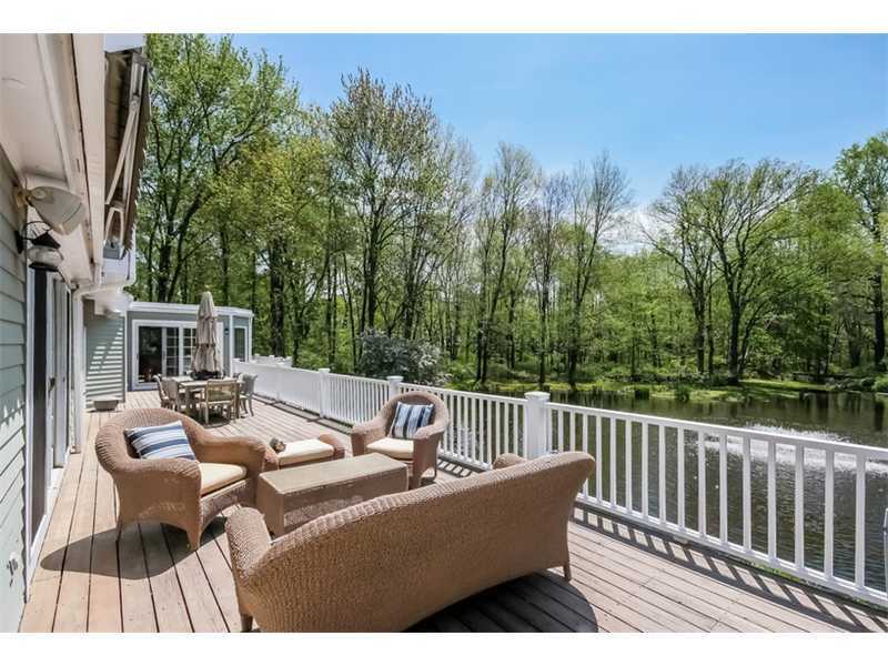 383 Middlesex Road Darien, CT 06820 - Photo 17 of 23 a view of a patio with couches chairs and wooden floor