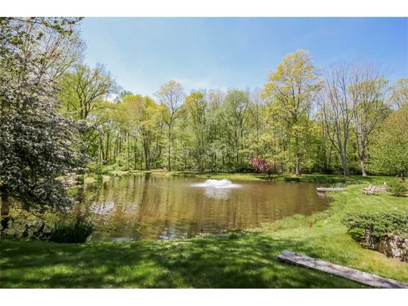 383 Middlesex Road Darien, CT 06820 - Photo 20 of 23 a view of a lake with houses in the back