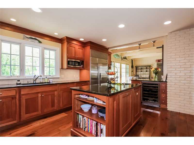 383 Middlesex Road Darien, CT 06820 - Photo 8 of 23 a kitchen with stainless steel appliances granite countertop a stove and cabinets