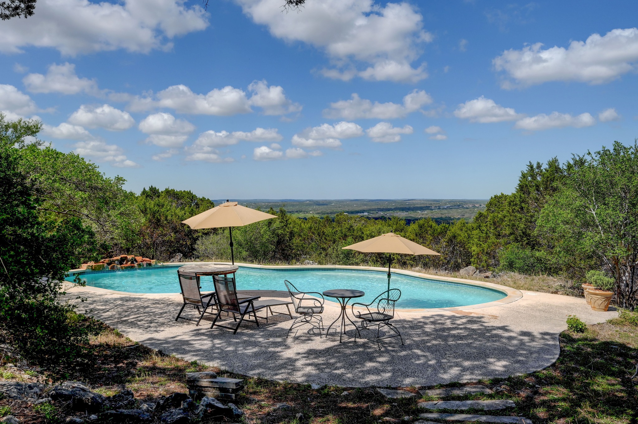 900 Box Canyon Road Wimberley, TX 78676 - Photo 3 of 40 Sweeping view of the Wimberley Valley from the pool area.