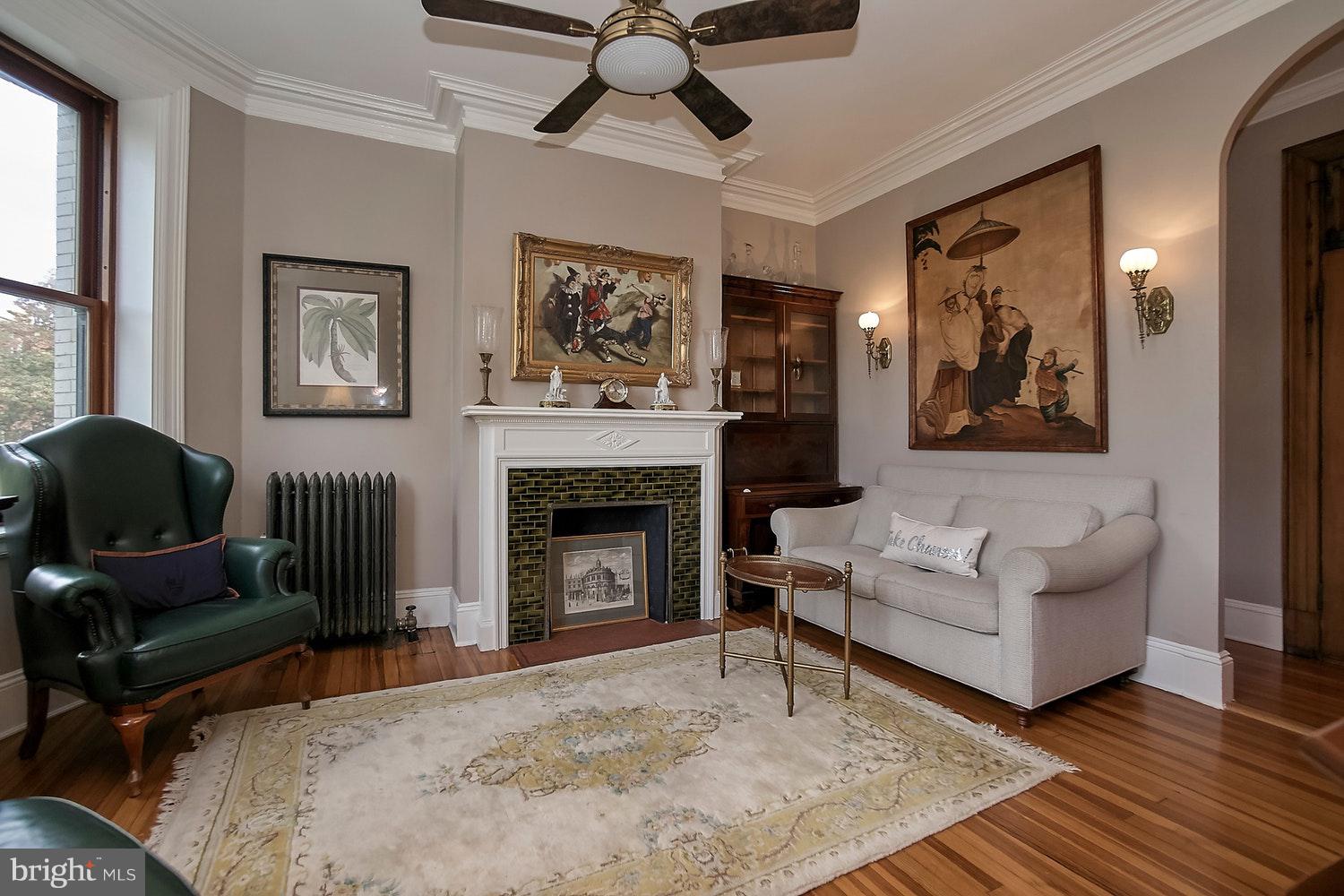 2220 20th Street Northwest, Unit 32 Washington, DC 20009 - Photo 7 of 20 a living room with furniture and a fireplace