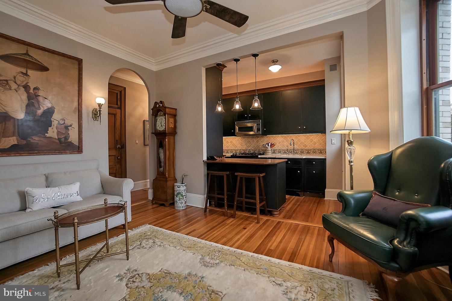 2220 20th Street Northwest, Unit 32 Washington, DC 20009 - Photo 8 of 20 a living room with furniture and a flat screen tv