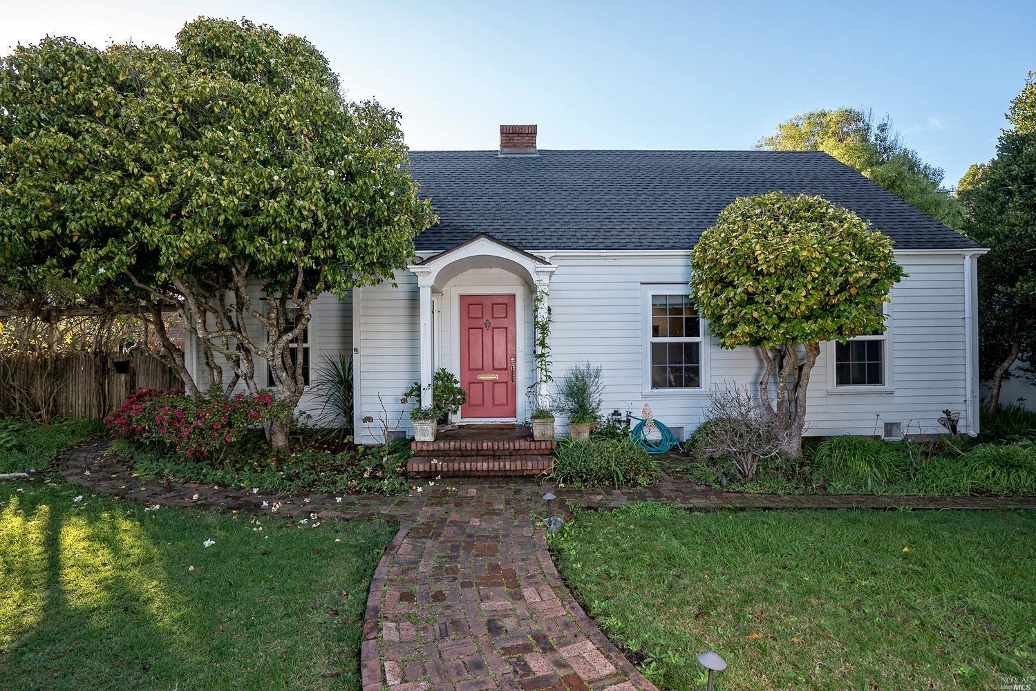 a front view of a house with garden