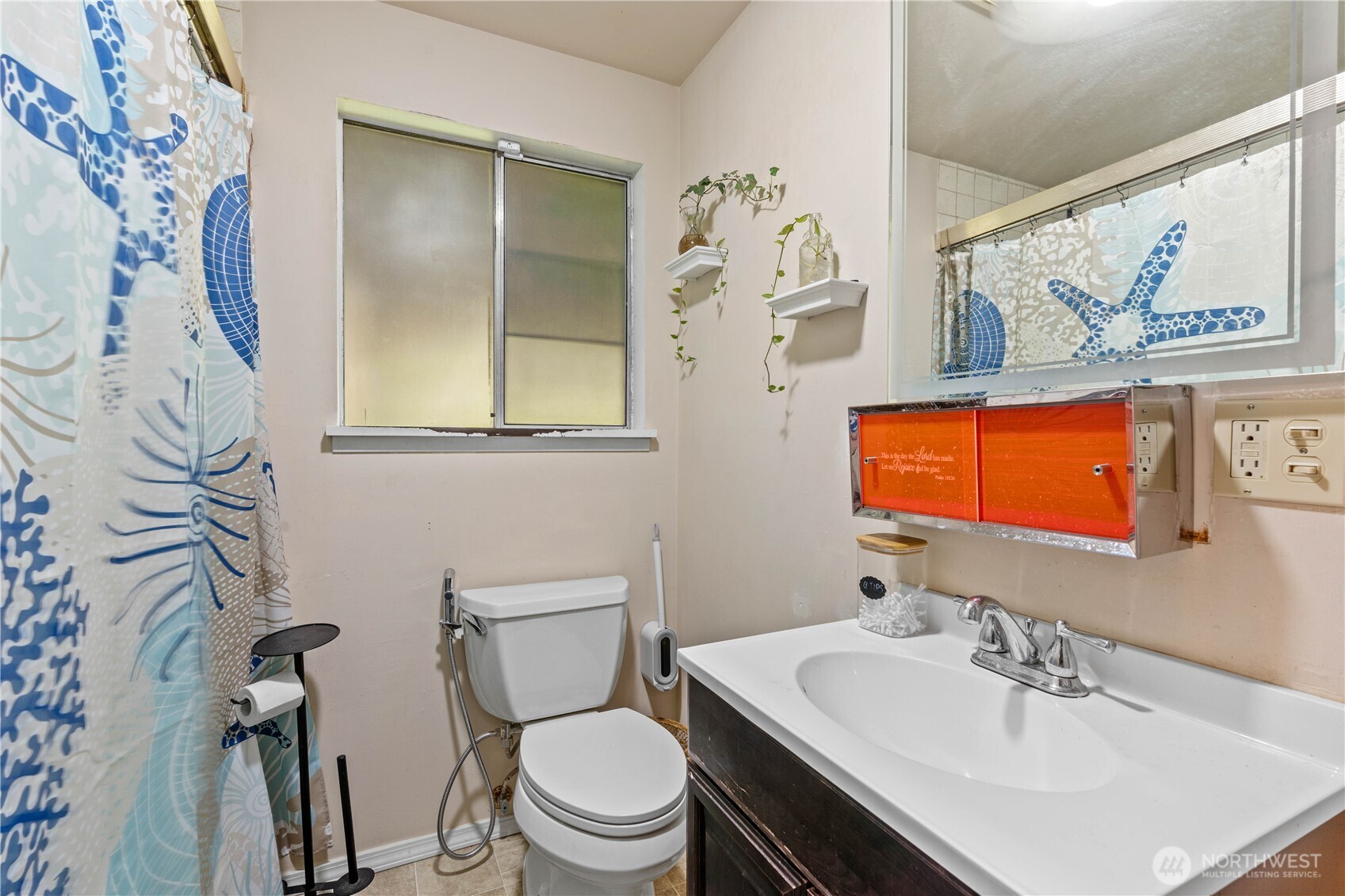 22415 Military Road South SeaTac, WA 98198 - Photo 14 of 31 a bathroom with a sink a toilet and a mirror